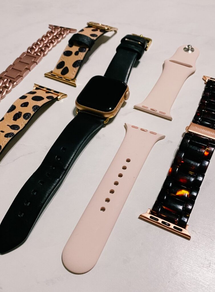 Variety of replacement Apple Watch bands - metal links, leather, leopard, tortoise shell.