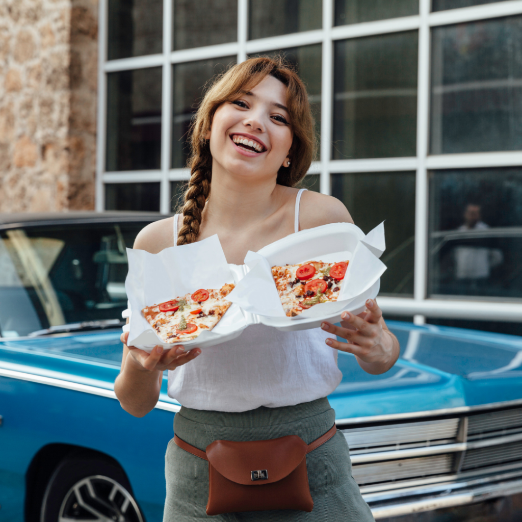 teen with pizza